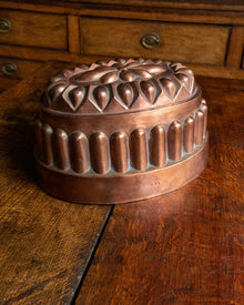 Copper mold on a wooden surface