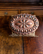 Decorative copper mould on a wooden surface