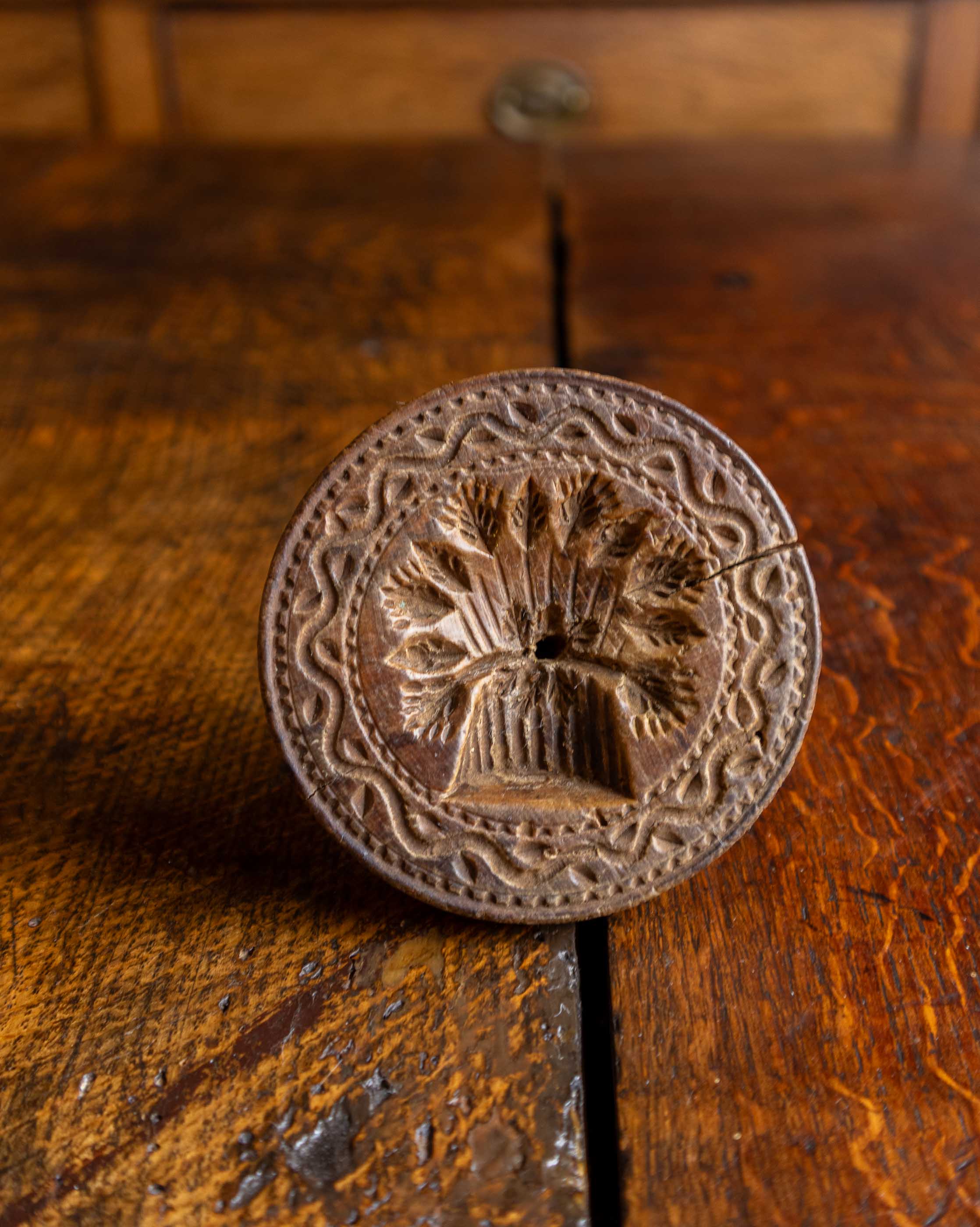 Decorative wooden stamp on a wooden surface
