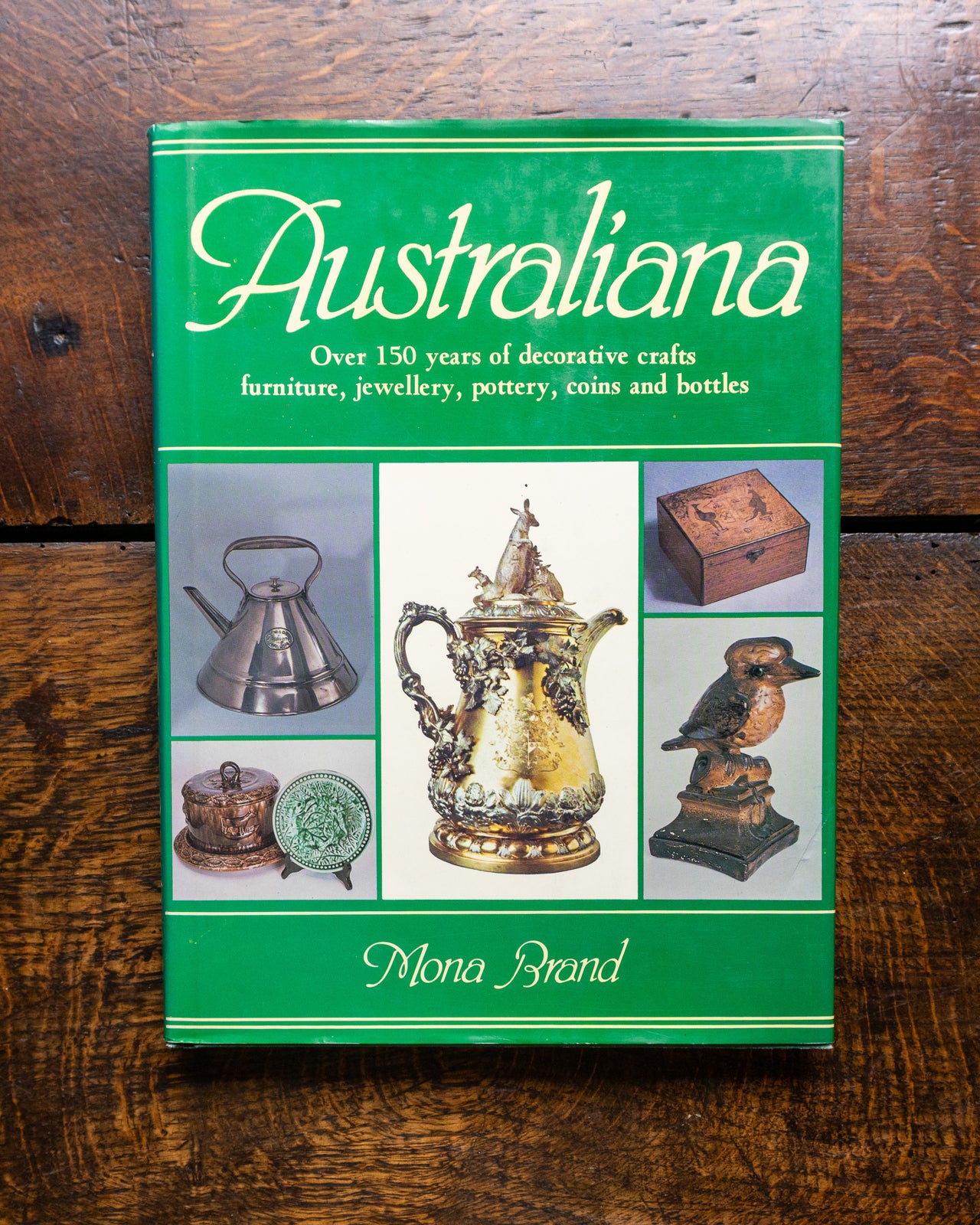 Book titled 'Australiana' on a wooden surface
