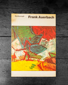 Book cover of 'Frank Auerbach' with abstract art design on a dark wooden surface