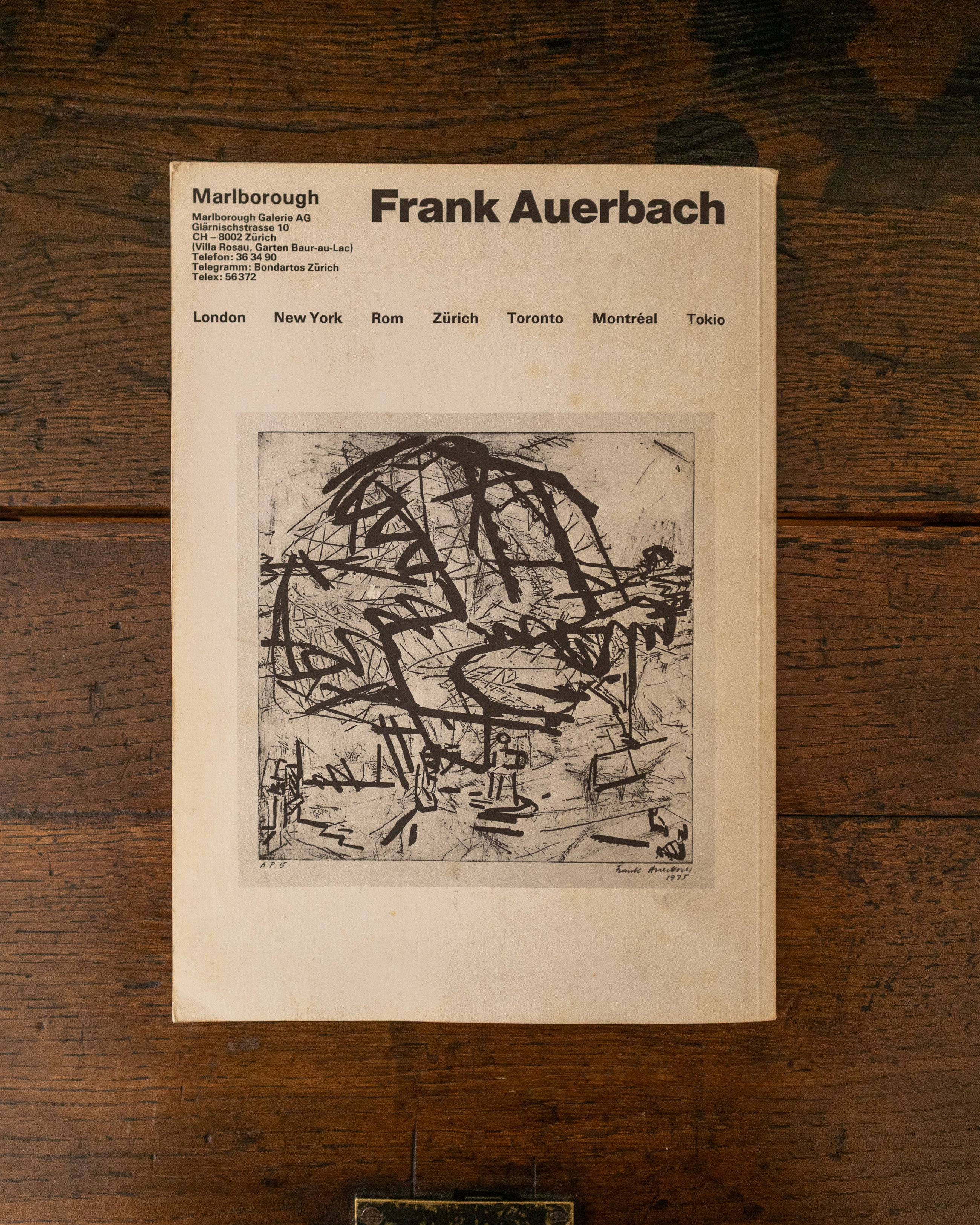 Back cover of Frank Auerbach art exhibition catalogue with abstract drawing on a wooden surface