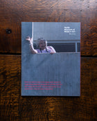 Back cover with an image of Mirka Mora waving on a wooden surface, featuring Heide Museum of Modern Art branding.