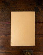 Back cover of a book on a wooden surface
