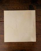 Back cover of a book on a wooden surface