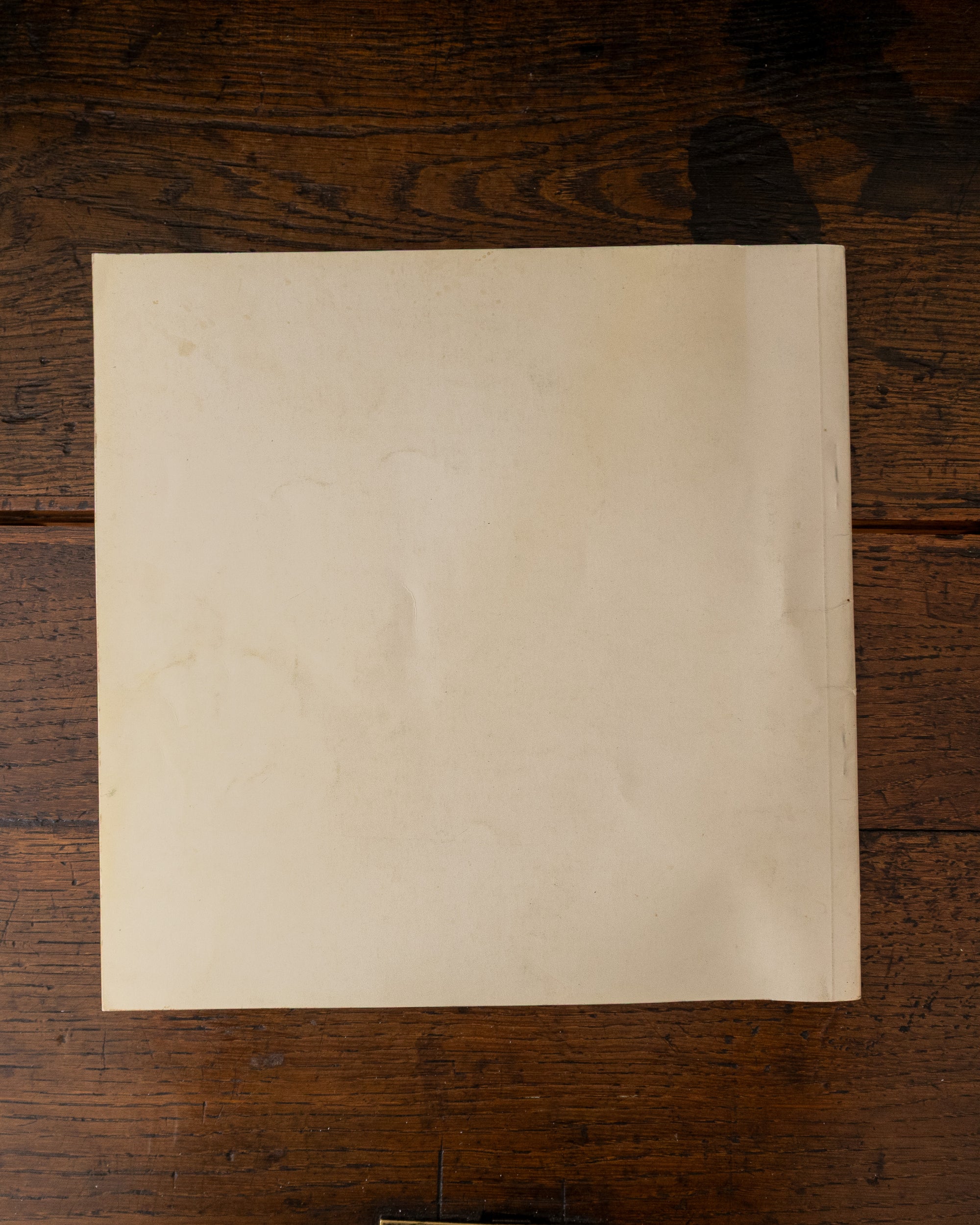 Back cover of a book on a wooden surface