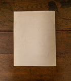 Back cover of book on a wooden surface