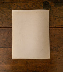 Back cover of book on a wooden surface