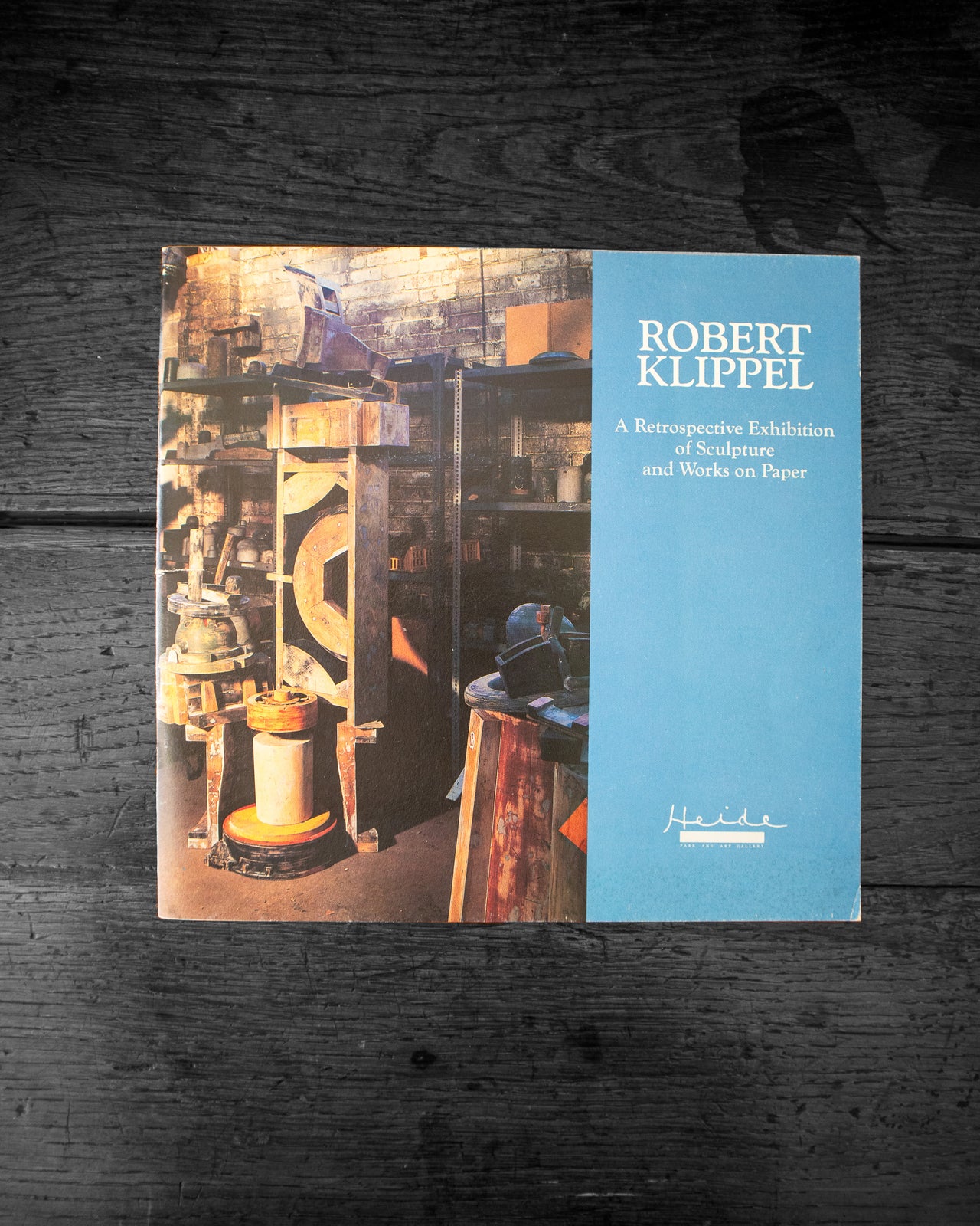 Cover of book featuring an image of sculptures and the text 'Robert Klippel' on a wooden surface.