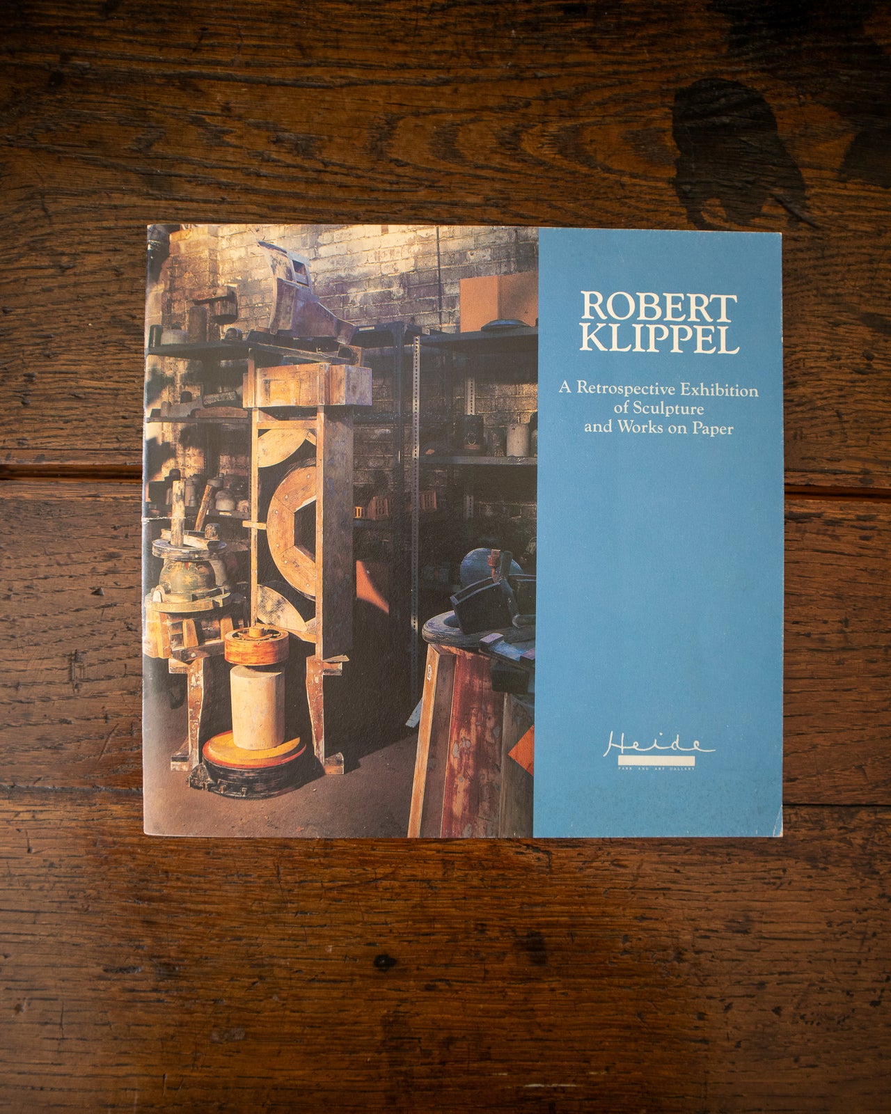 Cover of book featuring an image of sculptures and the text 'Robert Klippel' on a wooden surface.