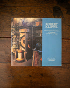 Cover of book featuring an image of sculptures and the text 'Robert Klippel' on a wooden surface.