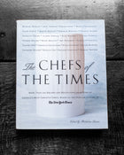Book titled 'The Chefs of the Times' on a textured surface